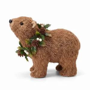 Oso navideño café con follaje y piñas