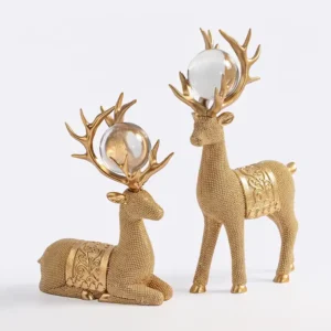 Set de renos navideños dorados con esfera decorativa